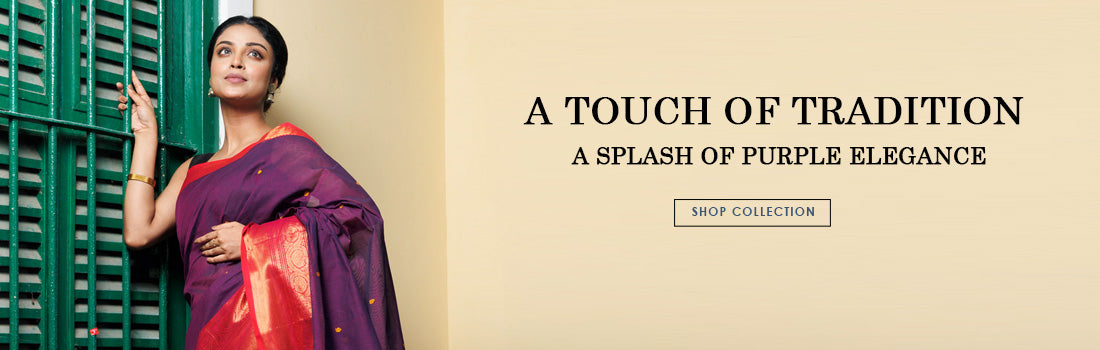 An Elegant woman wearing a stylish Handcrafted Saree with purple color