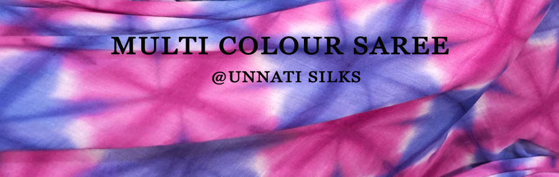 Woman twirling in a bright Multi Colour Saree with traditional motifs
