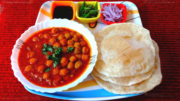 Enjoying hot Chole Bhature at home