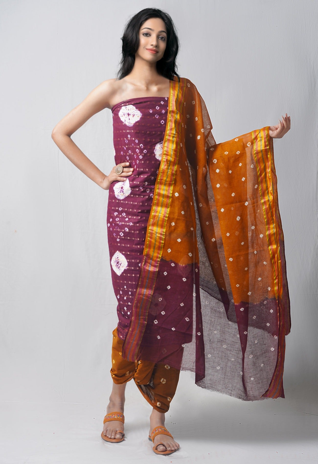 Online Shopping for Unstitched Dark Purple-Sepia Pure Bandhani Cotton Salwar Kameez with Tie and Dye Bandhani from Rajasthan at Unnatisilks.com India
