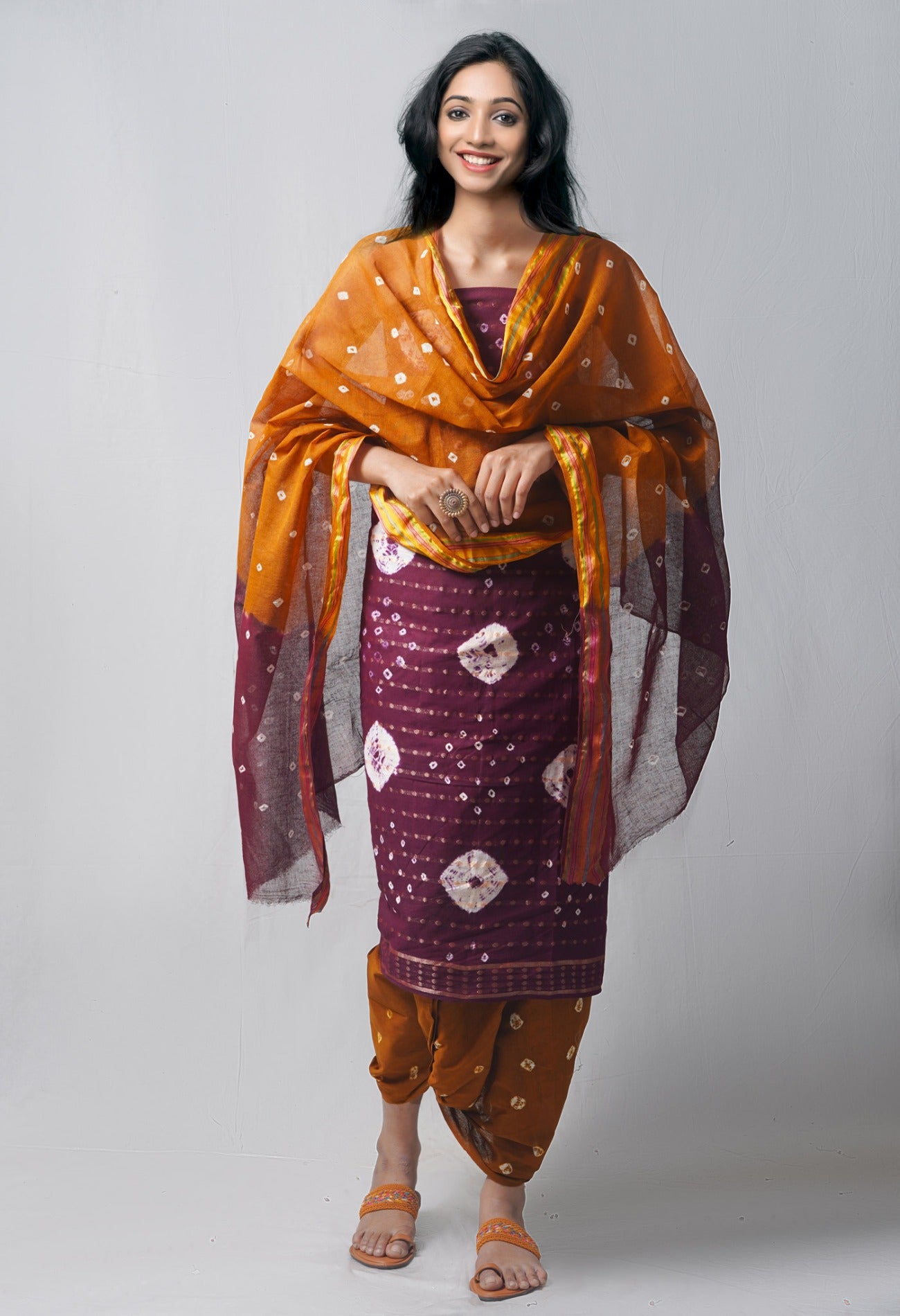 Online Shopping for Unstitched Dark Purple-Sepia Pure Bandhani Cotton Salwar Kameez with Tie and Dye Bandhani from Rajasthan at Unnatisilks.com India
